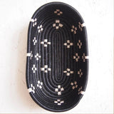 African Rwanda Woven Oval Bread Basket for Storage, Organization or Serving | Great for Remote Controller Storage or Baby Diapers and Wipes or Serving Bread on The Table - 11" long, 7" wide, 2.5" tall  Spotted Black & White